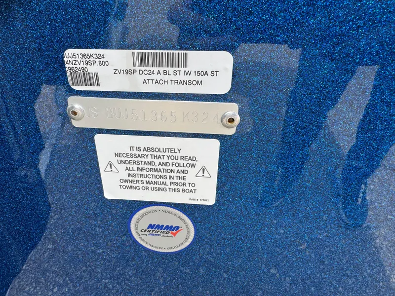 Slide: The Image of 2024 Nitro ZV19 Sport boat transom with safety and identification labels. - 15