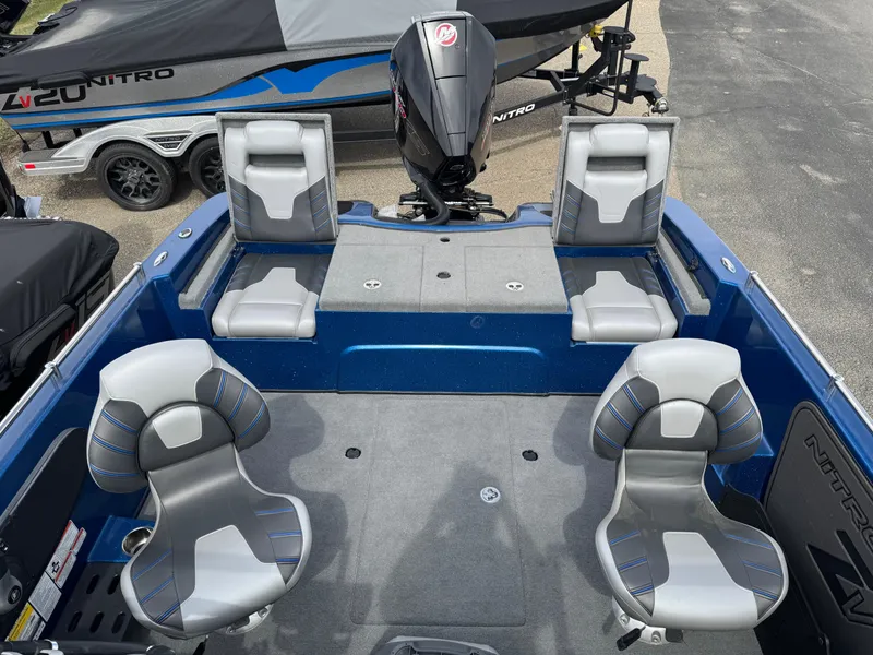 Slide: The Image of 2024 Nitro ZV19 Sport boat interior with seating and motor, showcasing modern design. - 4