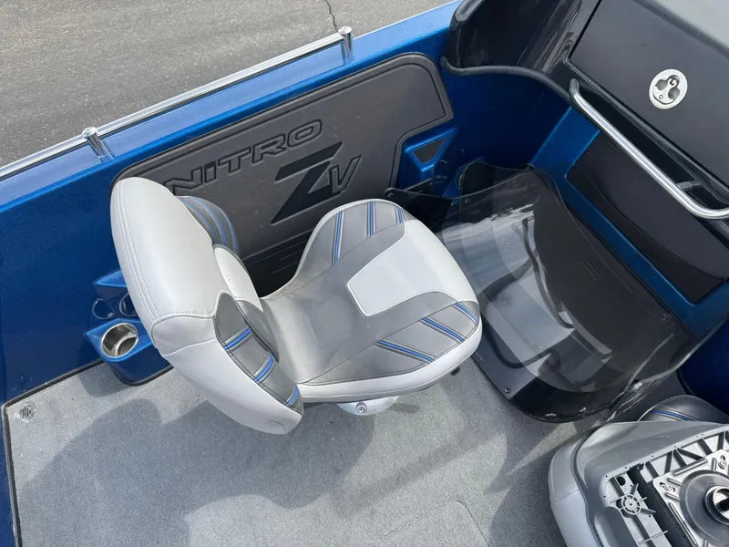 Slide: The Image of 2024 Nitro ZV19 Sport boat interior with gray and blue seating. - 8