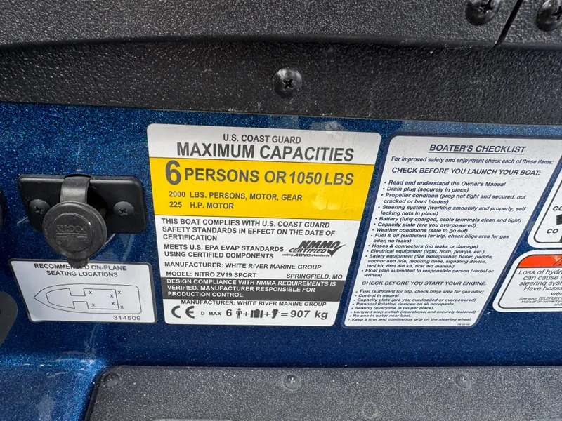 Slide: The Image of 2024 Nitro ZV19 Sport capacity label: 6 persons or 1050 lbs, 225 HP motor. - 9