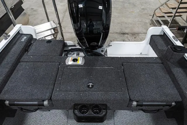 Slide: The Image of 2024 Lund 1675 Adventure Sport boat interior with motor and storage compartments. - 3