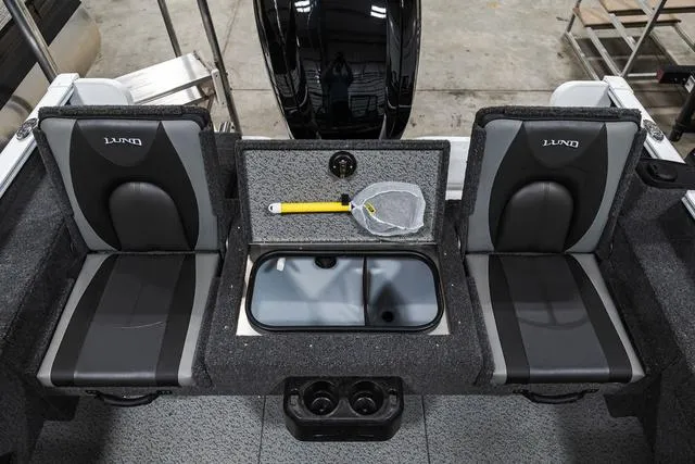 Slide: The Image of 2024 Lund 1675 Adventure Sport boat interior with seating and storage. - 4