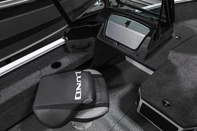 Slide: The Image of 2024 Lund 1675 Adventure Sport boat interior with seating and console. - 8