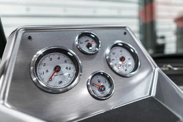 Slide: The Image of Close-up of 2024 Lund 2075 Tyee Sport boat dashboard gauges. - 12