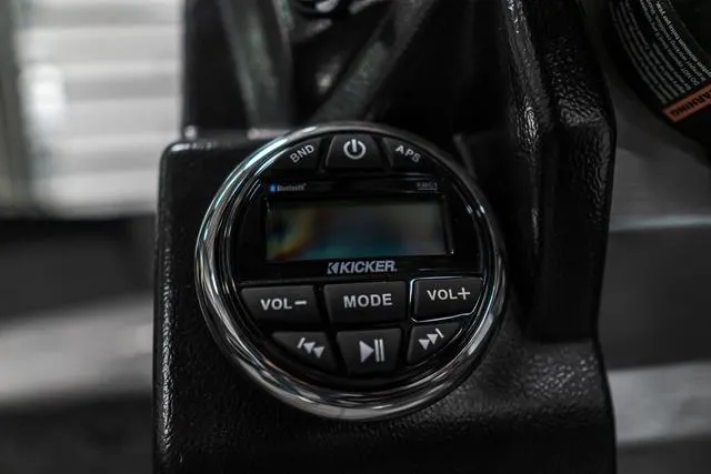 Slide: The Image of Close-up of Kicker audio control panel in 2024 Lund 2075 Tyee Sport boat. - 13
