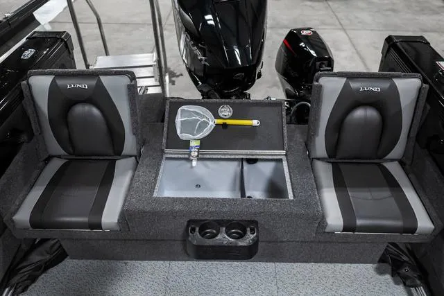 Slide: The Image of 2024 Lund 2075 Tyee Sport boat interior with seating and storage compartments. - 5