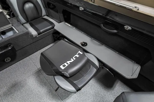 Slide: The Image of 2024 Lund 2075 Tyee Sport boat interior with seating and storage. - 7