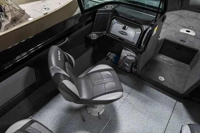 Slide: The Image of 2024 Lund 2075 Tyee Sport boat interior with seating and storage compartments. - 8
