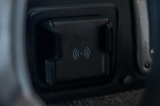 Slide: The Image of 2024 Lund 1775 Impact XS Sport boat interior with cushioned seat. - 11