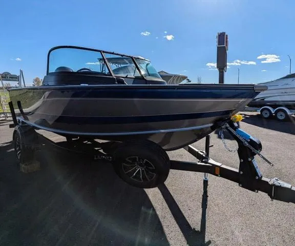 Slide: The Image of 2024 Lund 1775 Impact XS Sport dashboard gauges close-up. - 4