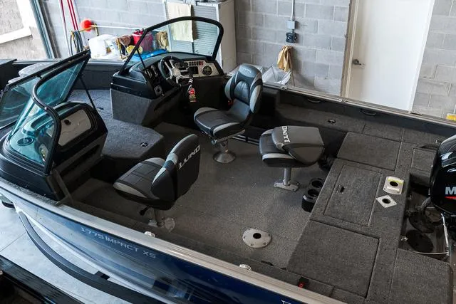 Slide: The Image of 2024 Lund 1775 Impact XS Sport interior storage compartment and seating. - 7