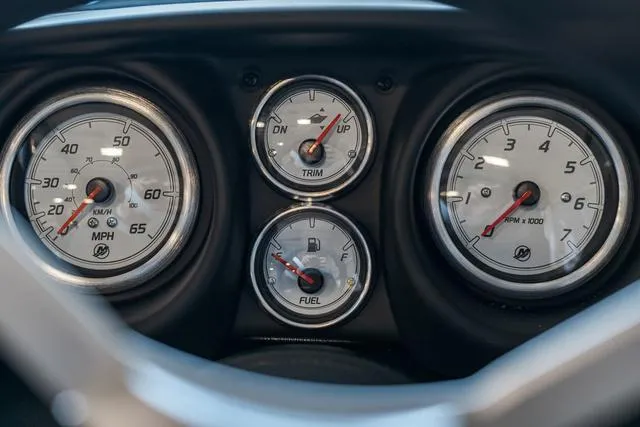 Slide: The Image of 2024 Lund 1775 Impact XS Sport boat interior with storage compartments and seats. - 9