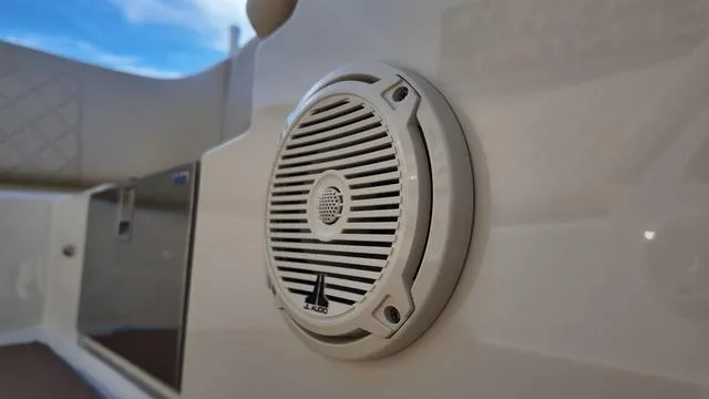 Slide: The Image of 2017 Chris-Craft 27 Launch boat cockpit with luxurious cream leather seating and wooden steering wheel. - 15