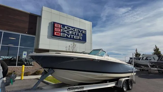 Slide: The Image of 2017 Chris-Craft 27 Launch boat with teak wood deck and beige upholstery. - 3
