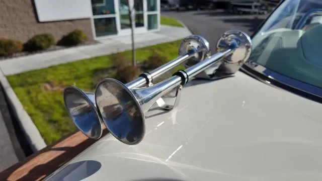 Slide: The Image of Close-up of dual chrome horns on a 2017 Chris-Craft 27 Launch boat. - 30