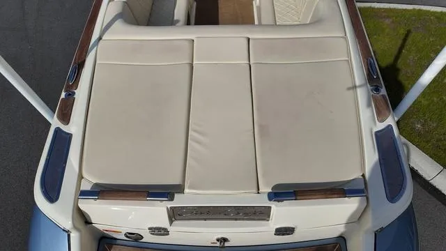 Slide: The Image of 2017 Chris-Craft 27 Launch boat storage compartment with open lid. - 9