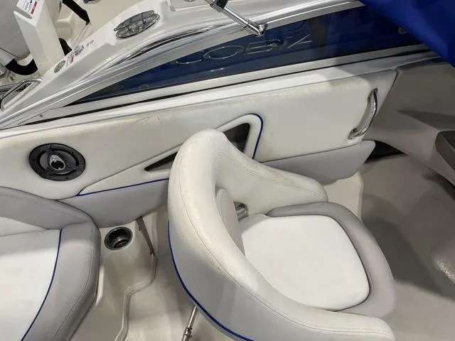 Slide: The Image of 2010 Bryant 210 BR boat cockpit with steering wheel and control panel. - 20