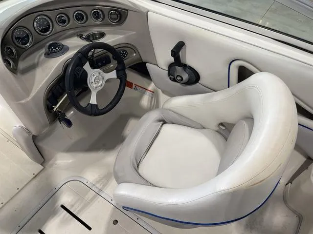 Slide: The Image of Open storage compartment in a 2010 Bryant 210 BR boat. - 21