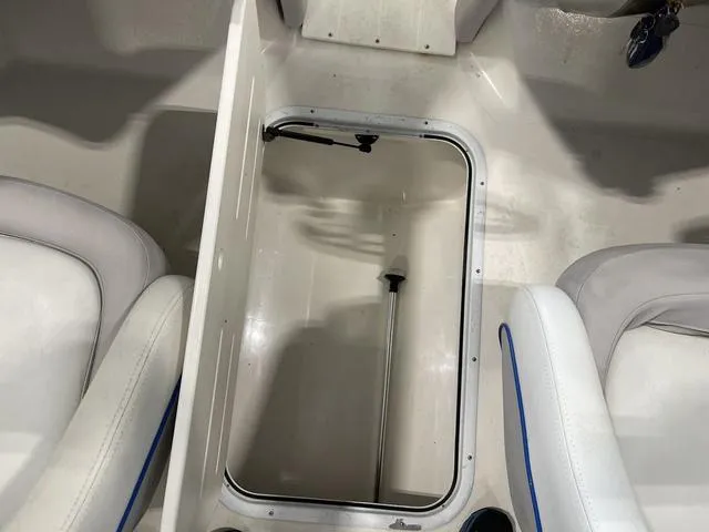 Slide: The Image of Storage compartment in a 2010 Bryant 210 BR boat. - 22