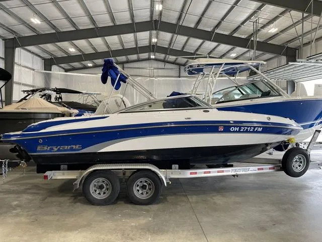 Slide: The Image of 2010 Bryant 210 BR boat on a Venture trailer in a storage facility. - 5