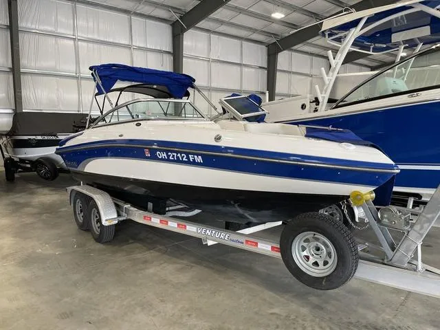 Slide: The Image of 2010 Bryant 210 BR boat deck with storage compartment. - 6