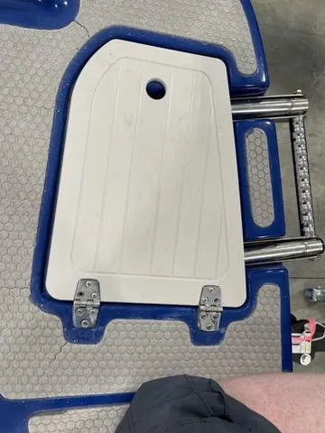 Slide: The Image of Foldable ladder on a 2010 Bryant 210 BR boat with blue and gray deck. - 9