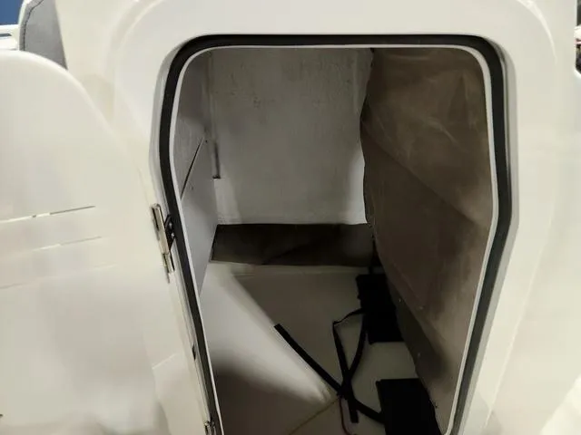 Slide: The Image of 2023 Stingray 173CC boat storage compartment interior. - 17