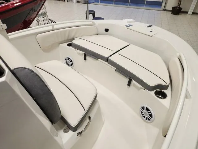 Slide: The Image of 2023 Stingray 173CC boat interior with cushioned seating and built-in speakers. - 19