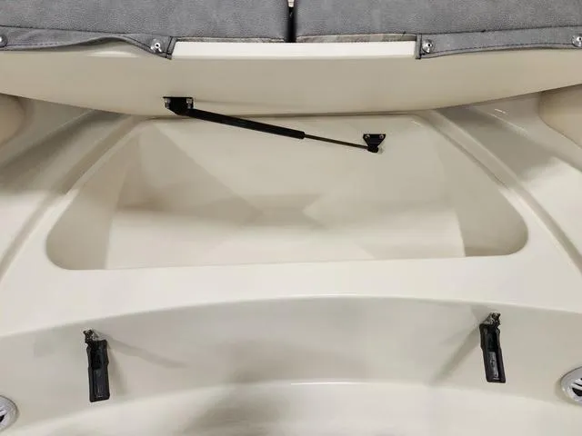 Slide: The Image of 2023 Stingray 173CC boat storage compartment with open lid. - 20