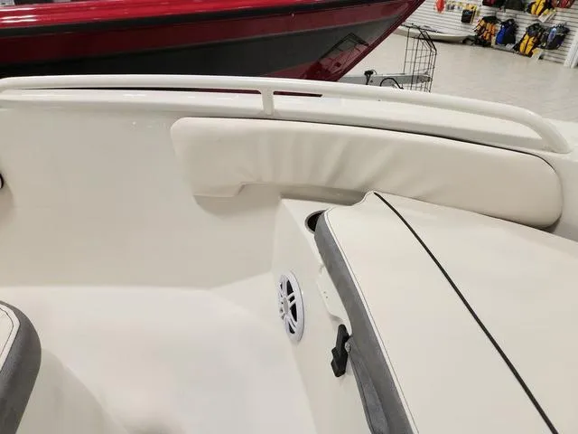 Slide: The Image of 2023 Stingray 173CC boat interior with white cushioned seating and speaker. - 21