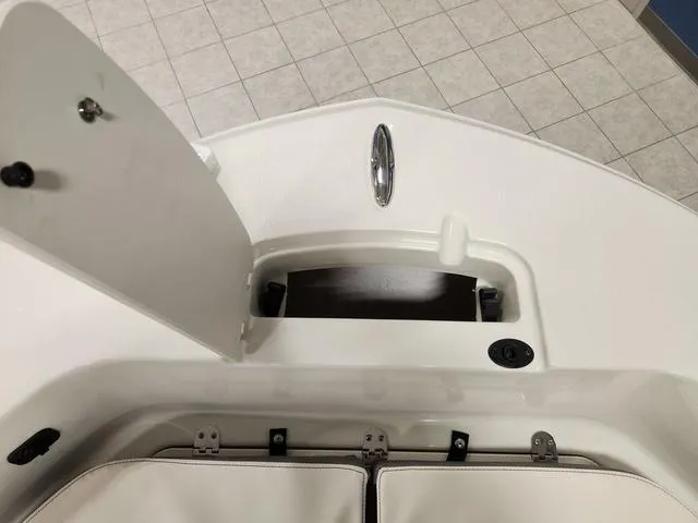 Slide: The Image of 2023 Stingray 173CC boat interior storage compartment with open hatch. - 22