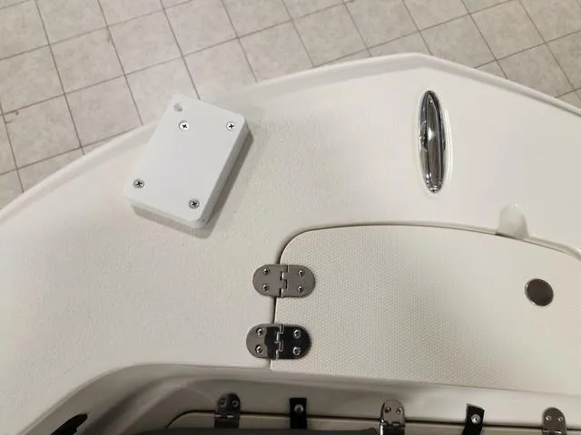 Slide: The Image of 2023 Stingray 173CC boat deck with storage compartment and hardware. - 23