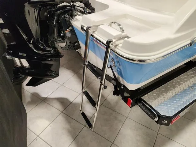 Slide: The Image of 2023 Stingray 173CC boat with ladder and motor, rear view. - 5