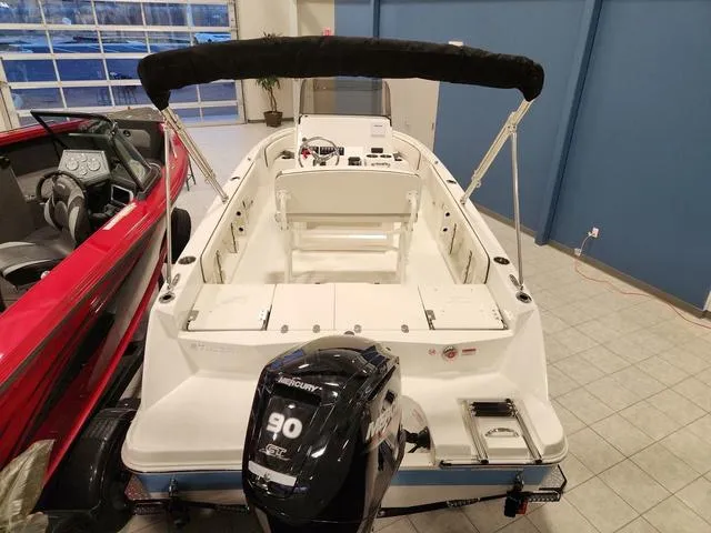 Slide: The Image of 2023 Stingray 173CC boat with Mercury 90 engine in showroom. - 6
