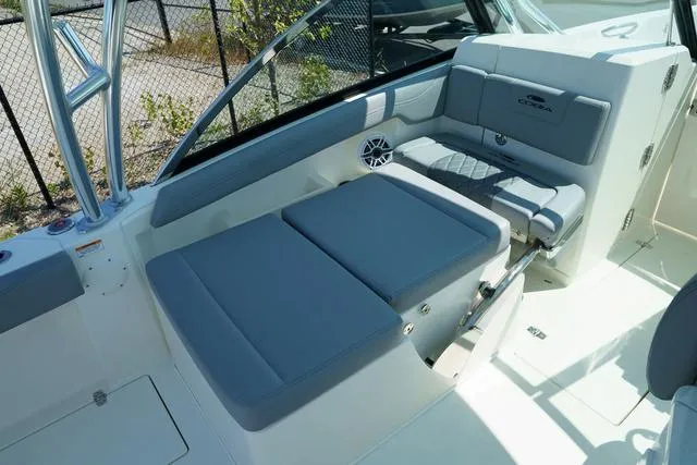 Slide: The Image of 2024 Cobia 240 DC boat interior with gray seating and modern design. - 14