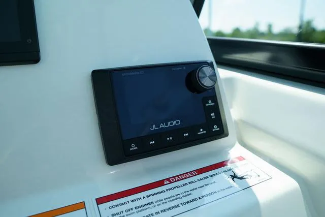 Slide: The Image of JL Audio system on 2024 Cobia 240 DC boat dashboard. - 20