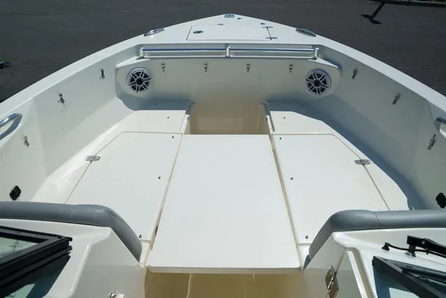 Slide: The Image of 2024 Cobia 240 DC boat interior with spacious seating and storage compartments. - 24
