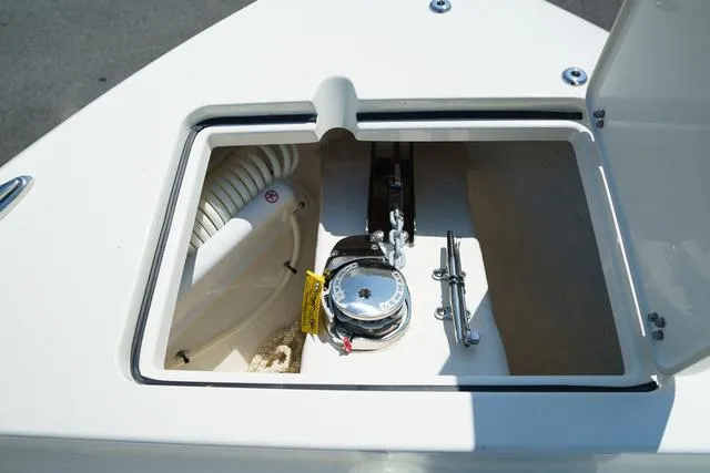 Slide: The Image of 2024 Cobia 240 DC anchor locker with chain and rope storage. - 29