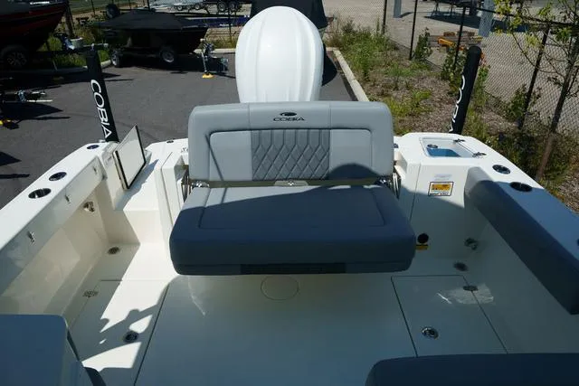 Slide: The Image of 2024 Cobia 240 DC boat interior with gray seating and modern design. - 5