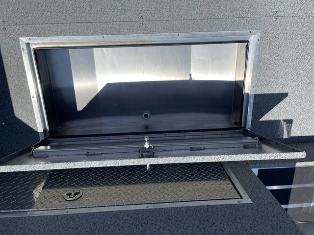 Slide: The Image of 2024 Thunder Jet Alexis OS 22' storage compartment with diamond plate flooring. - 17
