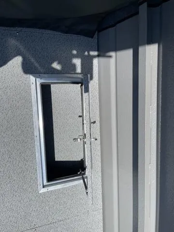 Slide: The Image of 2024 Thunder Jet Alexis OS 22' interior detail showing window frame and wall texture. - 19