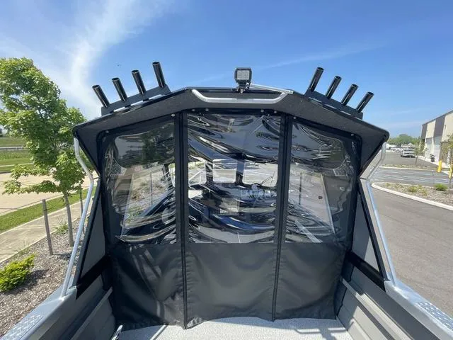 Slide: The Image of 2024 Thunder Jet Alexis OS 22' boat with enclosed cabin and rod holders. - 20