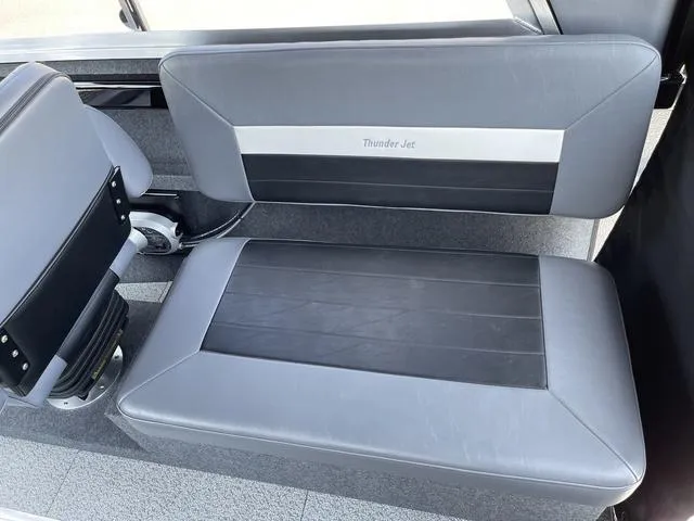 Slide: The Image of 2024 Thunder Jet Alexis OS 22' interior seating, gray and black upholstery. - 25