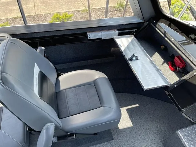 Slide: The Image of 2024 Thunder Jet Alexis OS 22' interior seating and storage area. - 29