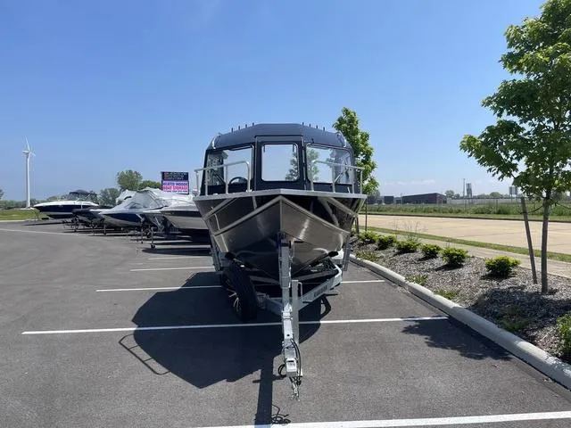 Slide: The Image of 2024 Thunder Jet Alexis OS 22' boat on trailer in parking lot. - 4