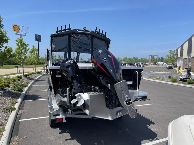 Slide: The Image of 2024 Thunder Jet Alexis OS 22' boat on trailer in parking lot. - 6