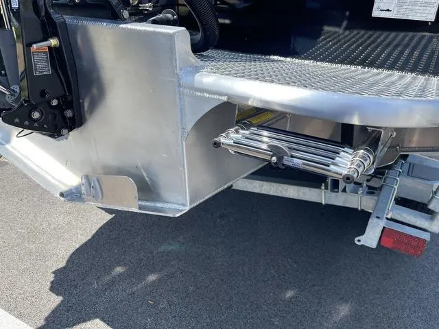 Slide: The Image of 2024 Thunder Jet Alexis OS 22' boat rear view, showing aluminum construction and ladder. - 8