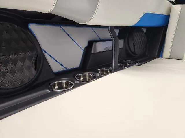 Slide: The Image of Interior of 2023 Malibu 26 LSV boat with cup holders and speakers. - 42