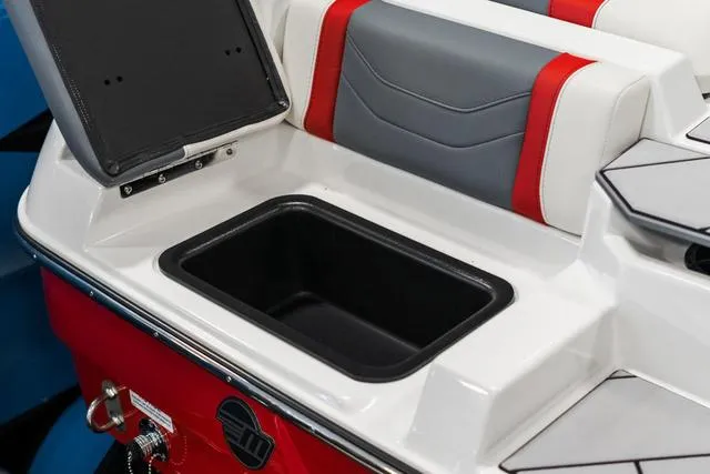 Slide: The Image of 2024 Malibu 23 LSV boat with open storage compartment and red, white, and gray seating. - 10