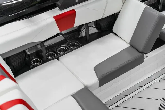 Slide: The Image of 2024 Malibu 23 LSV storage compartment, black interior, close-up view. - 19